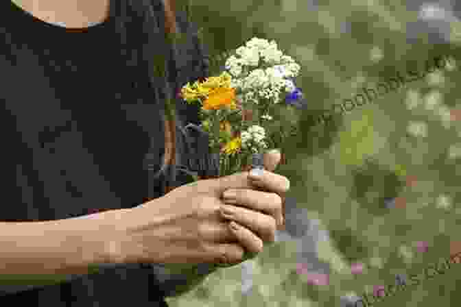 A Close Up Of A Woman's Hand Holding A Handful Of Wildflowers Against The Backdrop Of A Lush Forest. Forage (Penguin Poets) Rose McLarney