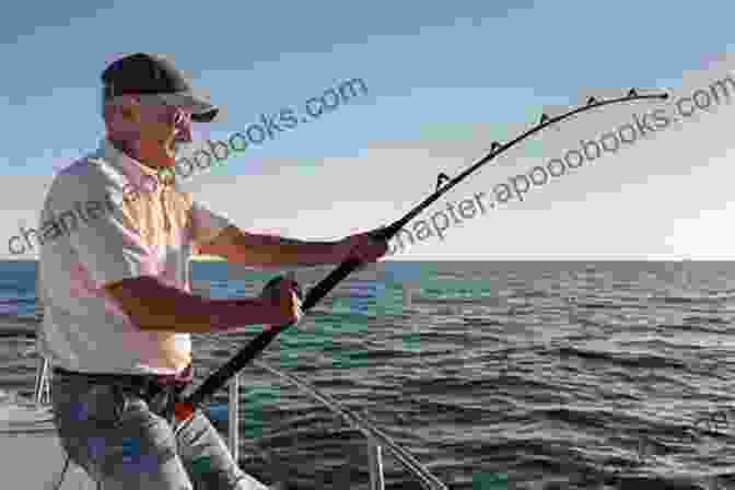 A Fisherman Reeling In A Catch While Trolling From A Boat Basics Of Fisheries Science (A Complete On Fisheries) Fishing Craft And Gear Technology