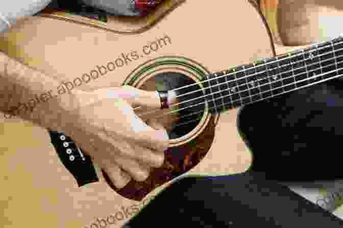 A Guitarist Fingerpicking On An Acoustic Guitar The Guitar Three Chord Songbook Volume 2 G C D: Melody/Lyrics/Chords