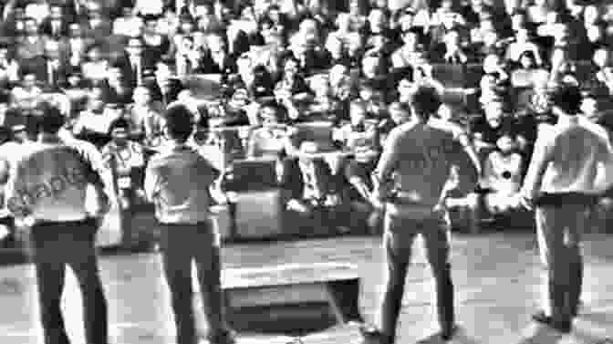 A Scene From The Play 'Offending The Audience' With A Group Of People Confronting The Audience. Kaspar And Other Plays Peter Handke