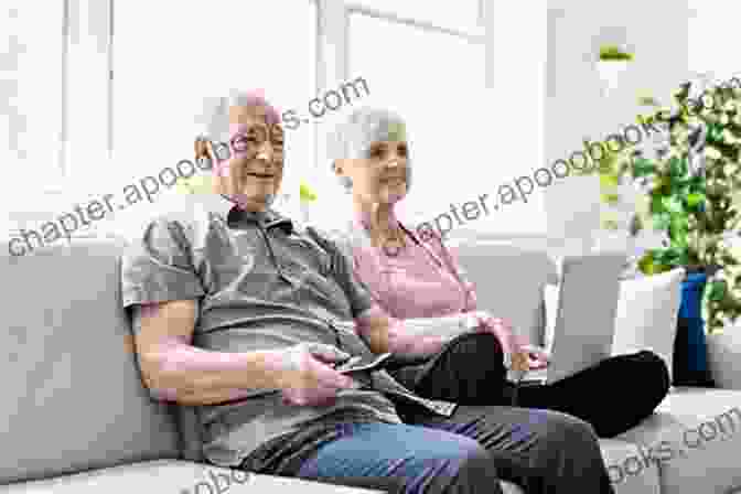 An Elderly Couple Sitting On A Couch, Sharing A Book And Smiling At Each Other. Dancing Lessons: A Short Story Romance About Battling Alzheimer S